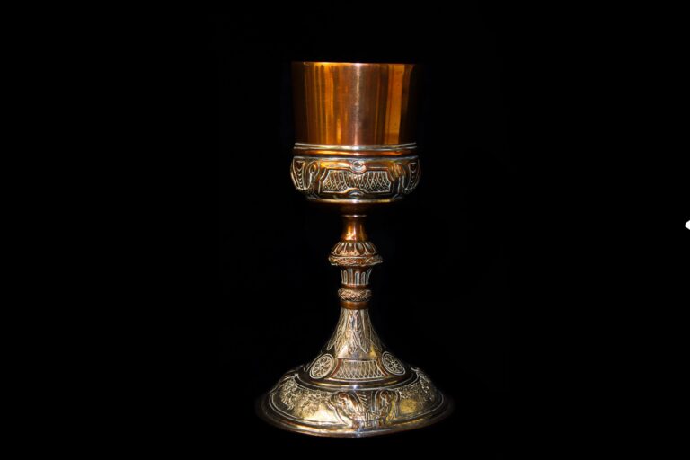 Silver and copper chalice found by an Australian serviceman in the burnt-out remains of the Lutheran mission after the fall of Finschhafen in Sept 1943. Item # 17503